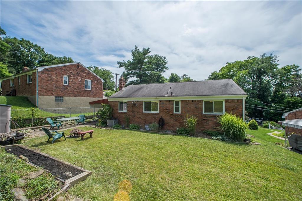1313 McCully Road Pittsburgh, PA 15234 - Photo 24 of 25 This view of the rear exterior shows the location of the uncovered patio area and planting beds.