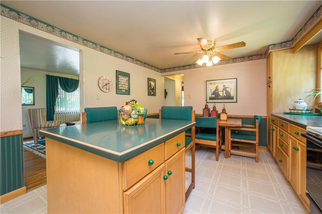 1313 McCully Road Pittsburgh, PA 15234 - Photo 8 of 25 The opening into the living room is shown at the left side of this kitchen photo.