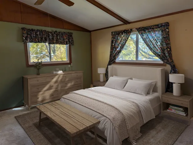 a bedroom with a bed and a window