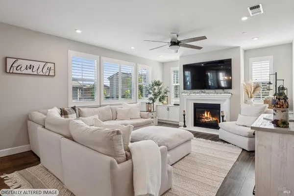 a kitchen that has a lot of cabinets in it and appliances