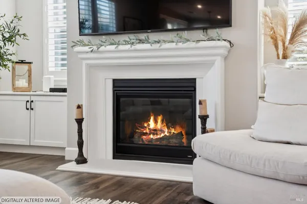 a kitchen with stainless steel appliances granite countertop a sink a stove and a wooden floor