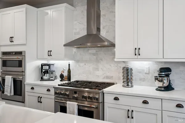 a bathroom with a tub a sink and a shower
