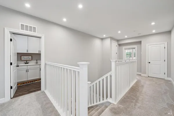 a utility room with sink dryer and washer