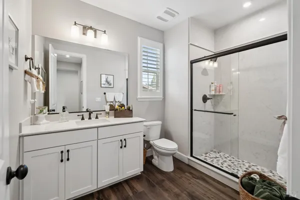 a bathroom with a sink toilet and shower