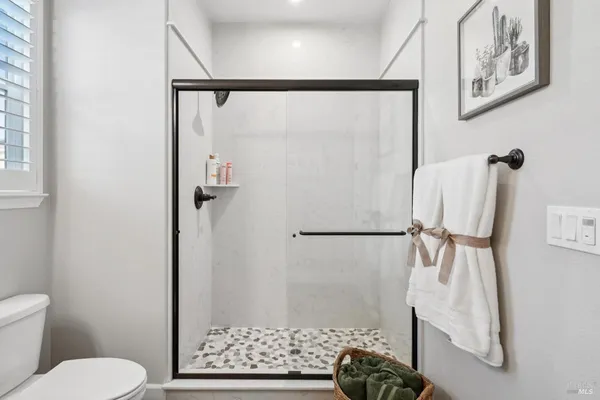 a view of a house with a yard and sitting area