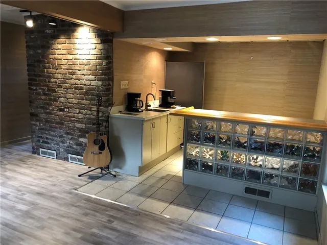 a kitchen with a sink cabinets and counter top space