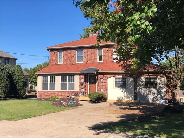 front view of a house and a yard
