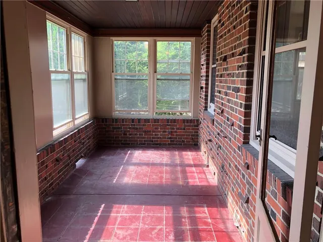 a bathroom with a bathtub and window