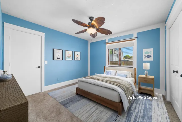 a bedroom with a large bed and a window