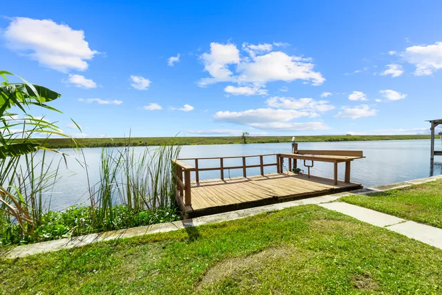 a view of a backyard with swimming pool