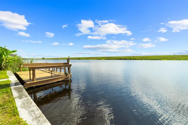 a view of a terrace with outdoor seating and city view