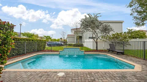 a view of a swimming pool with a backyard