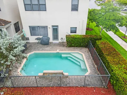 a balcony with table and chairs