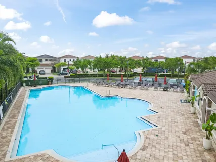 a view of a swimming pool and a chairs
