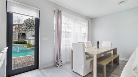 a view of a room with workspace and a window