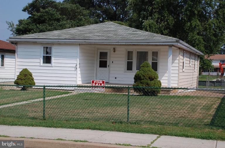 3103 Grace Road Sparrows Point, MD 21219 - Photo 1 of 3 a front view of a house with a yard