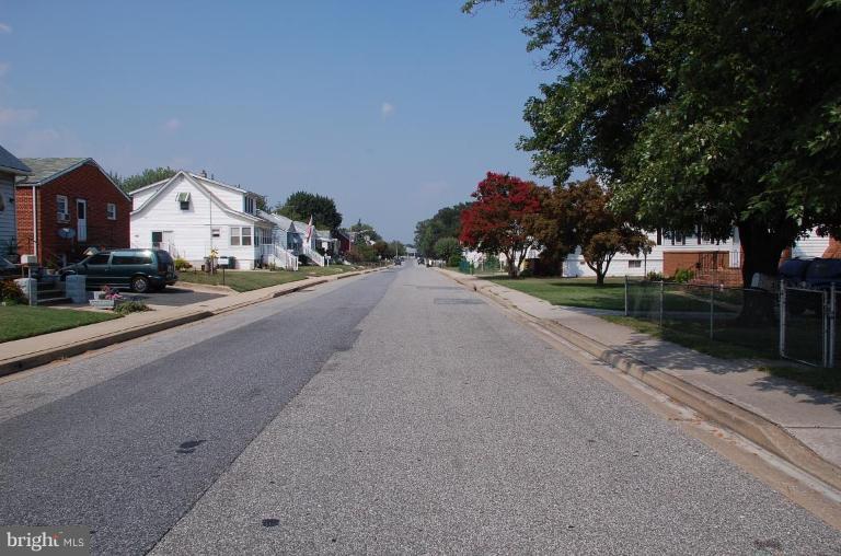 3103 Grace Road Sparrows Point, MD 21219 - Photo 3 of 3 a view of a street with a car parked in front of it