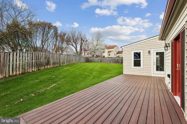 a view of a backyard with wooden floor
