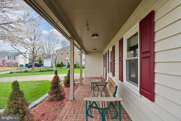 a view of an house with backyard porch and sitting area