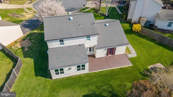 an aerial view of a house with swimming pool garden and outdoor seating