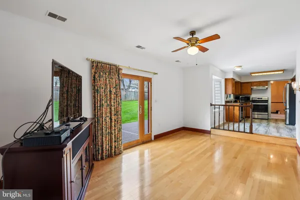 a view of a livingroom with furniture and a flat screen tv