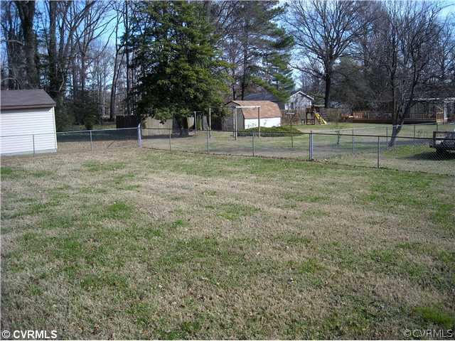 9531 Chester Road North Chesterfield, VA 23237 - Photo 12 of 12 a front view of a house with a yard and trees