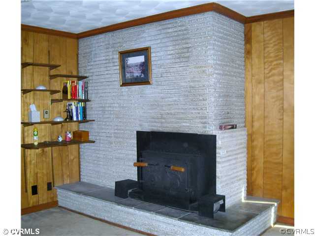 9531 Chester Road North Chesterfield, VA 23237 - Photo 6 of 12 a brick house with a sink and a fireplace
