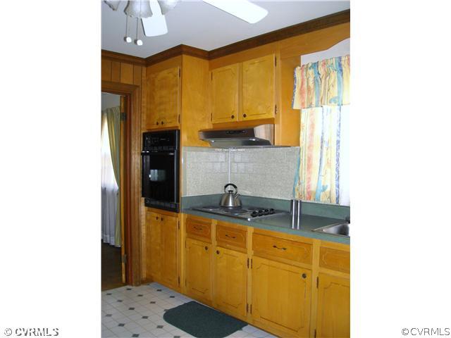 9531 Chester Road North Chesterfield, VA 23237 - Photo 7 of 12 a kitchen with stainless steel appliances granite countertop a sink and a refrigerator
