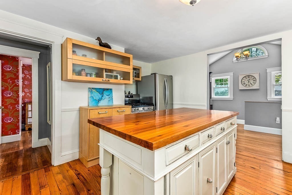 61 Crane Street Dedham, MA 02026 - Photo 12 of 42 a kitchen with a stove and a refrigerator