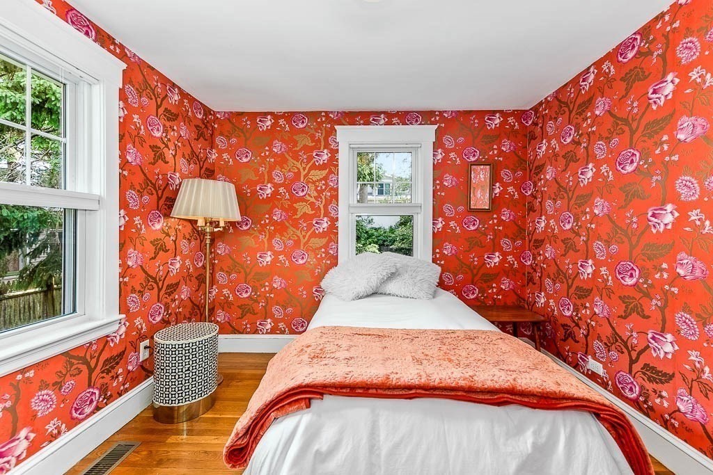 61 Crane Street Dedham, MA 02026 - Photo 18 of 42 a bedroom with a bed and wooden floor