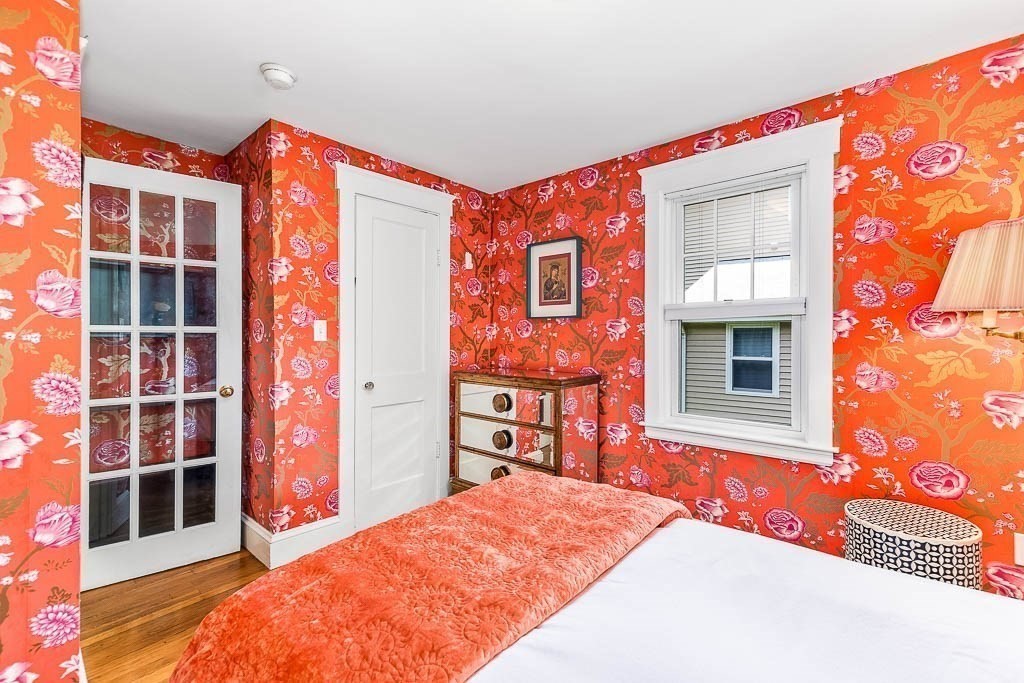 61 Crane Street Dedham, MA 02026 - Photo 19 of 42 a bedroom with a bed and wooden floor