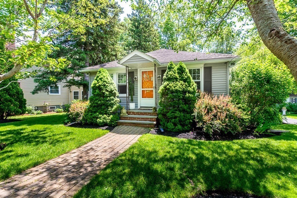 61 Crane Street Dedham, MA 02026 - Photo 2 of 42 a front view of a house with a yard