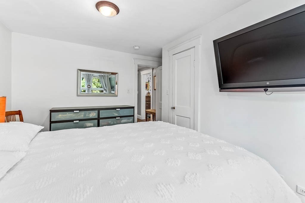 61 Crane Street Dedham, MA 02026 - Photo 22 of 42 a view of a livingroom with a flat screen tv