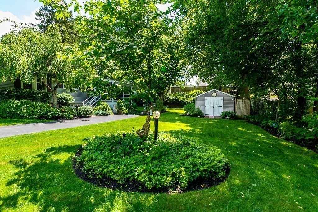 61 Crane Street Dedham, MA 02026 - Photo 27 of 42 a view of a house with a yard