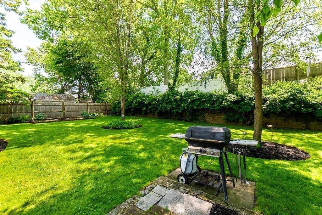 61 Crane Street Dedham, MA 02026 - Photo 35 of 42 a view of a backyard with sitting area