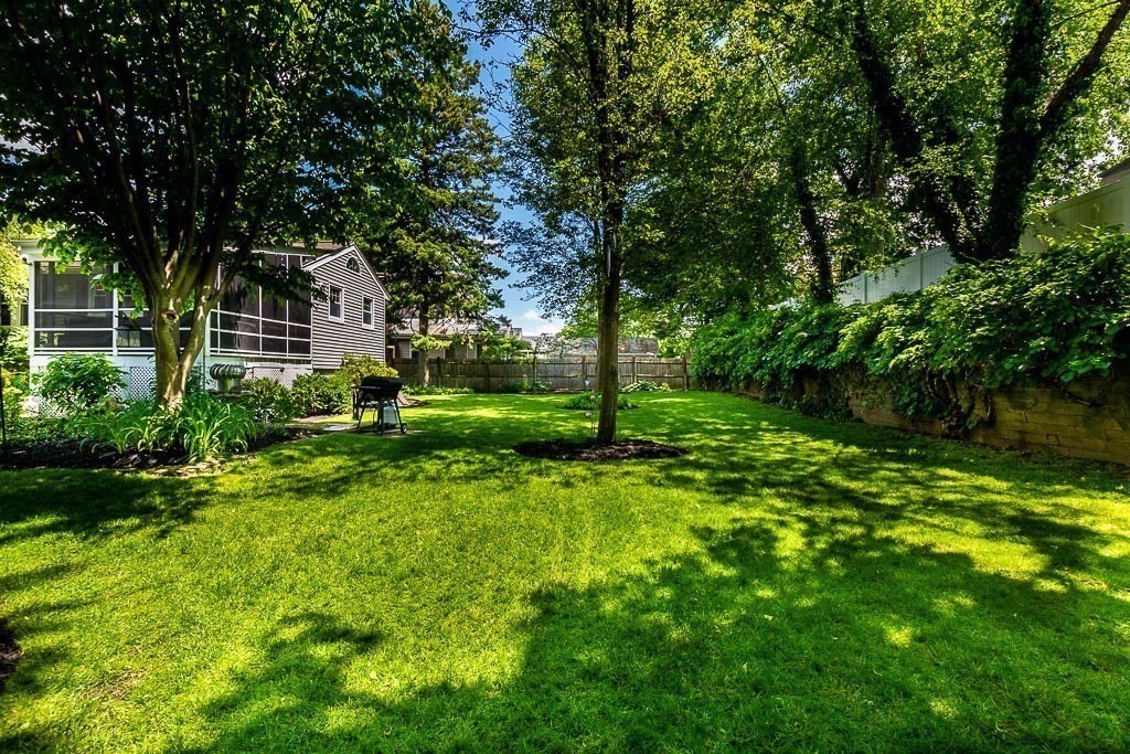 61 Crane Street Dedham, MA 02026 - Photo 36 of 42 a view of a house with a big yard and large trees