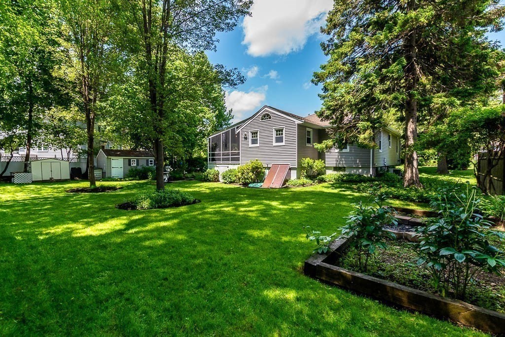 61 Crane Street Dedham, MA 02026 - Photo 38 of 42 a view of house that has a yard