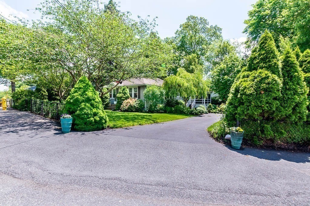 61 Crane Street Dedham, MA 02026 - Photo 41 of 42 a view of a road with a house in the background