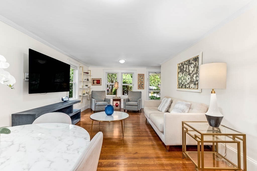 61 Crane Street Dedham, MA 02026 - Photo 7 of 42 a living room with furniture and a flat screen tv