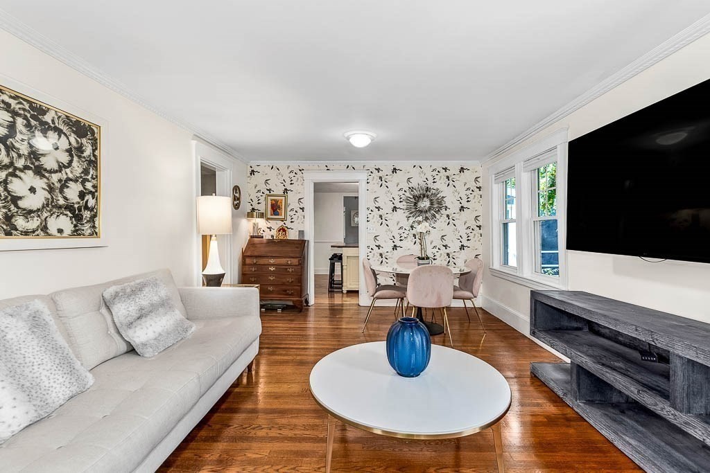 61 Crane Street Dedham, MA 02026 - Photo 9 of 42 a living room with furniture and a flat screen tv