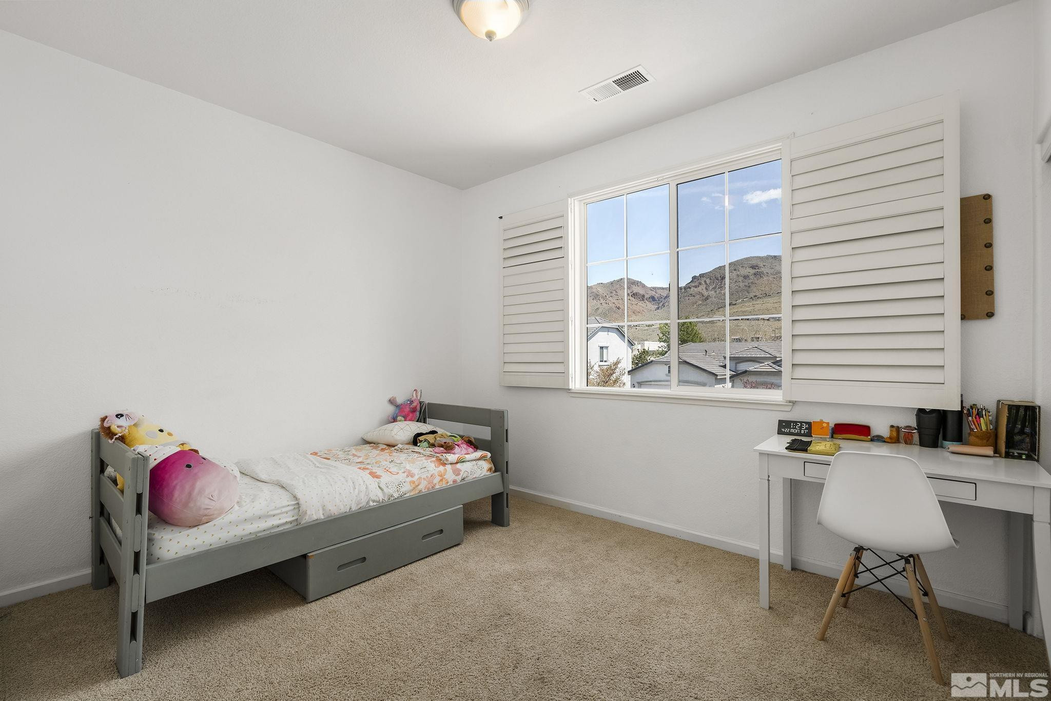 10537 Fort Morgan Way Reno, NV 89521 - Photo 19 of 30 a bedroom with furniture and a window