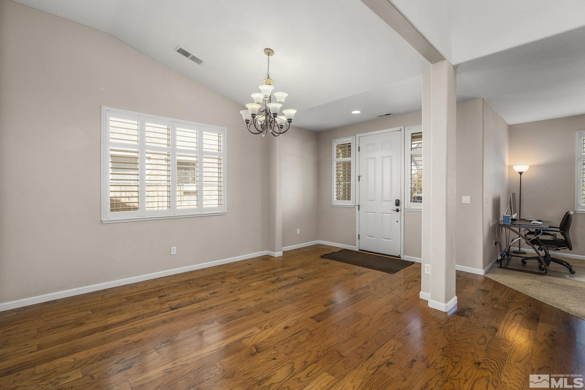 10537 Fort Morgan Way Reno, NV 89521 - Photo 5 of 30 a view of livingroom with hardwood floor and window