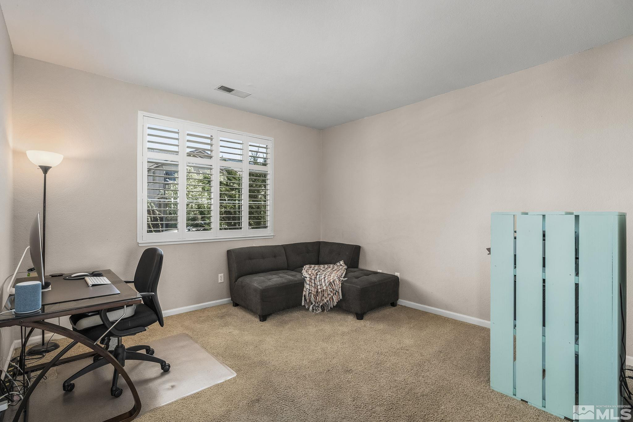 10537 Fort Morgan Way Reno, NV 89521 - Photo 6 of 30 a living room with furniture and a window