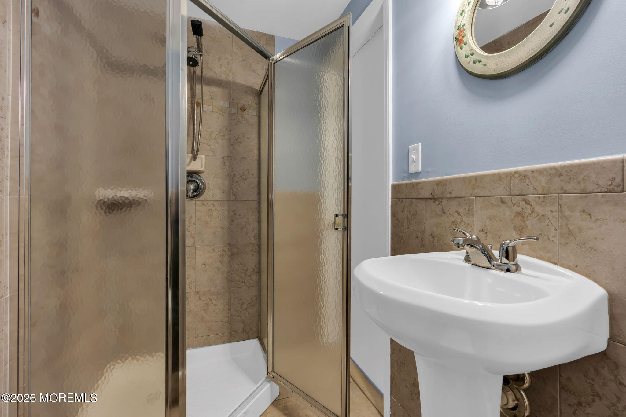 1208 Pine Tree Way, Unit BACK HOUSE Belmar, NJ 07719 - Photo 13 of 24 a bathroom with a sink and a mirror