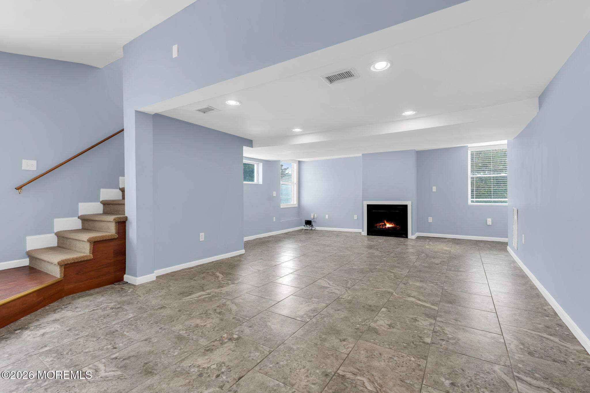 1208 Pine Tree Way, Unit BACK HOUSE Belmar, NJ 07719 - Photo 5 of 24 a view of an empty room with a fireplace