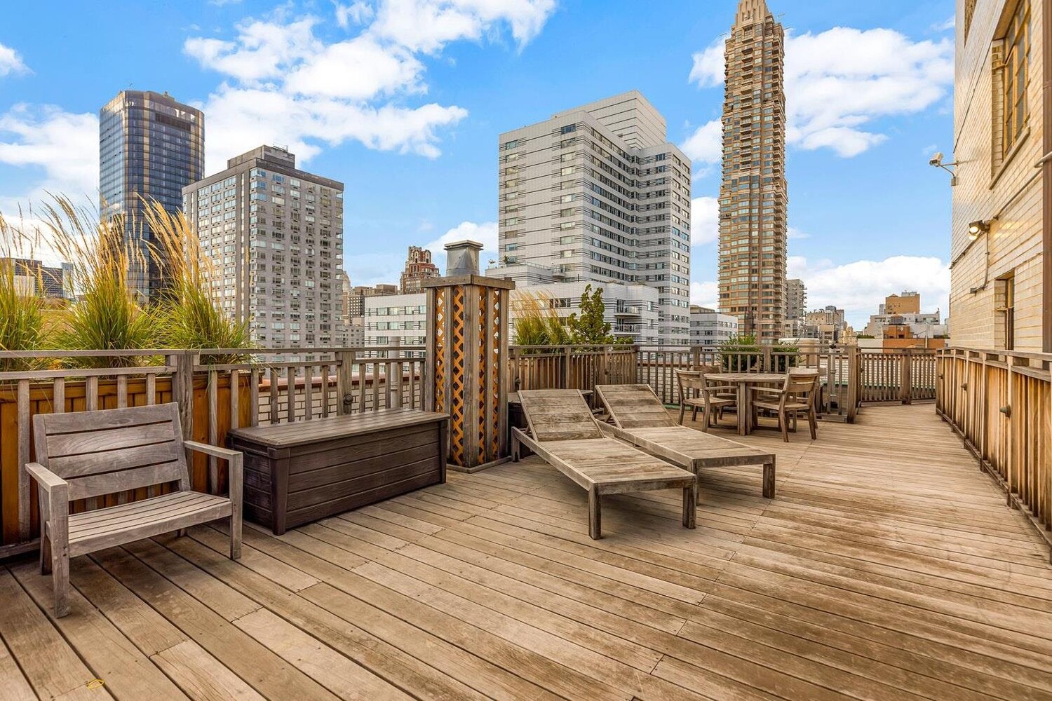 301 East 69th Street, Unit 4B Manhattan, NY 10021 - Photo 7 of 11 a view of a balcony with wooden benches