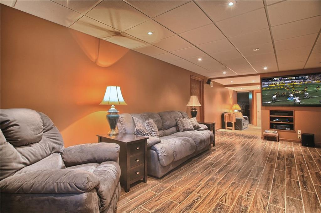 424 Winter Road New Castle, PA 16101 - Photo 16 of 20 Lower level finished game room with ceramic tile floor and recessed lighting