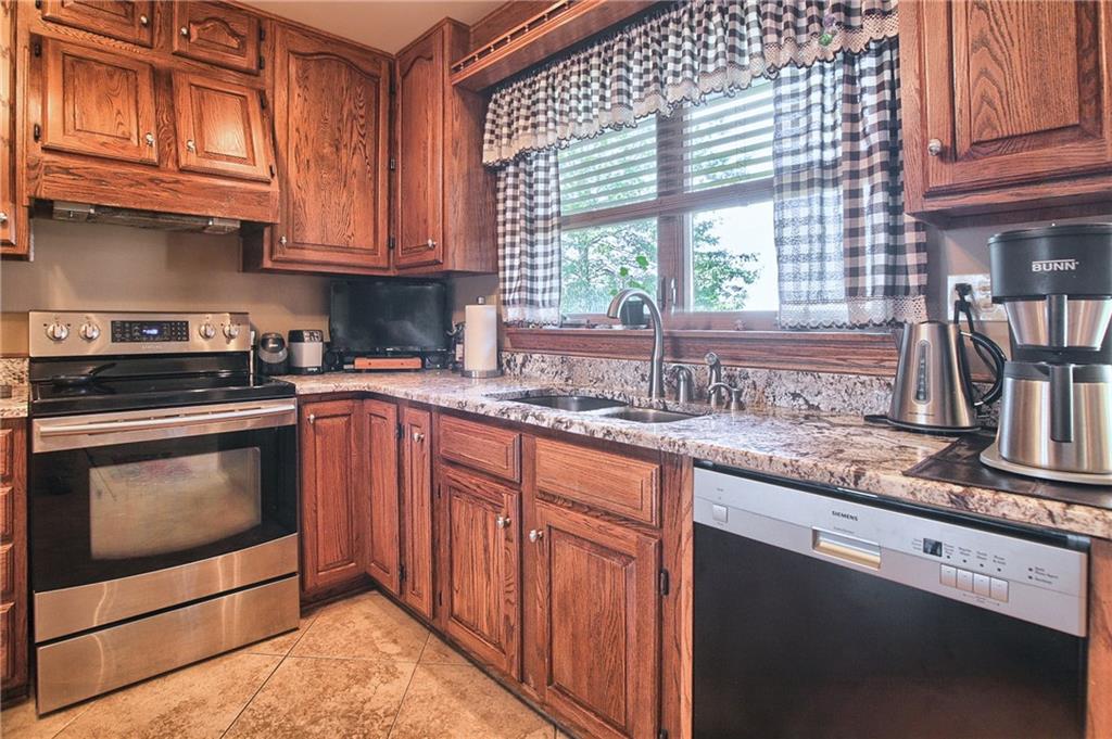 424 Winter Road New Castle, PA 16101 - Photo 7 of 20 Kitchen with granite counter, solid oak cabinets and stainless steel appliances