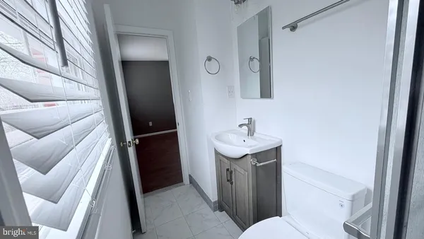 a bathroom with a sink and mirror