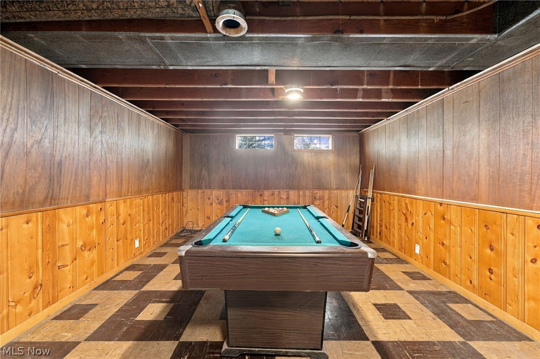 1434 Sunset Road Mayfield Heights, OH 44124 - Photo 31 of 36 Wood-paneled room featuring an exposed beam ceiling, checkerboard flooring, and recessed windows
